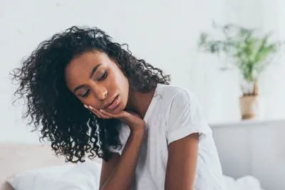 woman needing emergency dental care in Sacramento CA