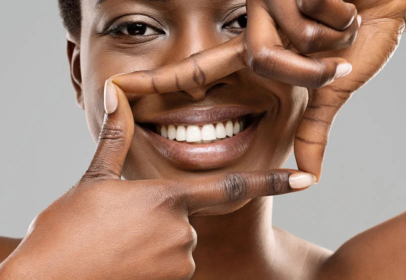 woman loving her smile after dental care from Gateway Oaks Dental