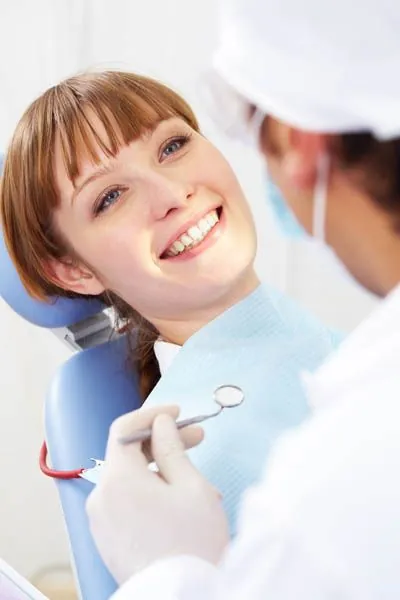 woman getting dental care at Gateway Oaks Dental
