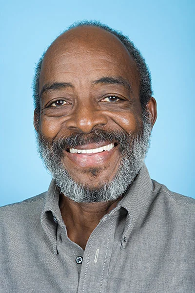 man smiling after getting dental crowns at Gateway Oaks Dental