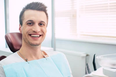 man getting oral cancer screening at Gateway Oaks Dental