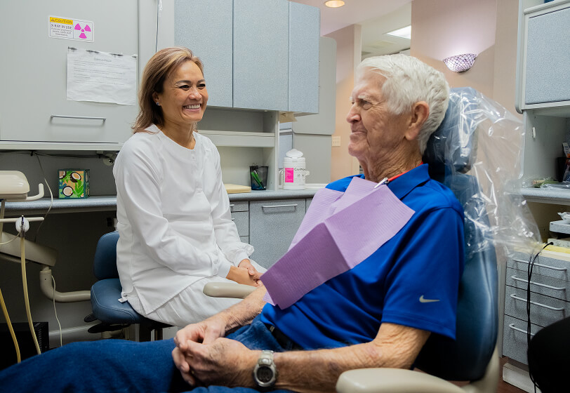 Patient receiving a restorative dentistry consult from Dr. Truong